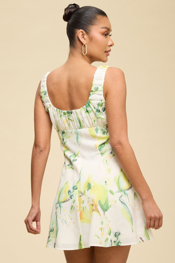 Lemon print ruched bust tie-front flowy mini dress - back view showing ruched straps and open back
