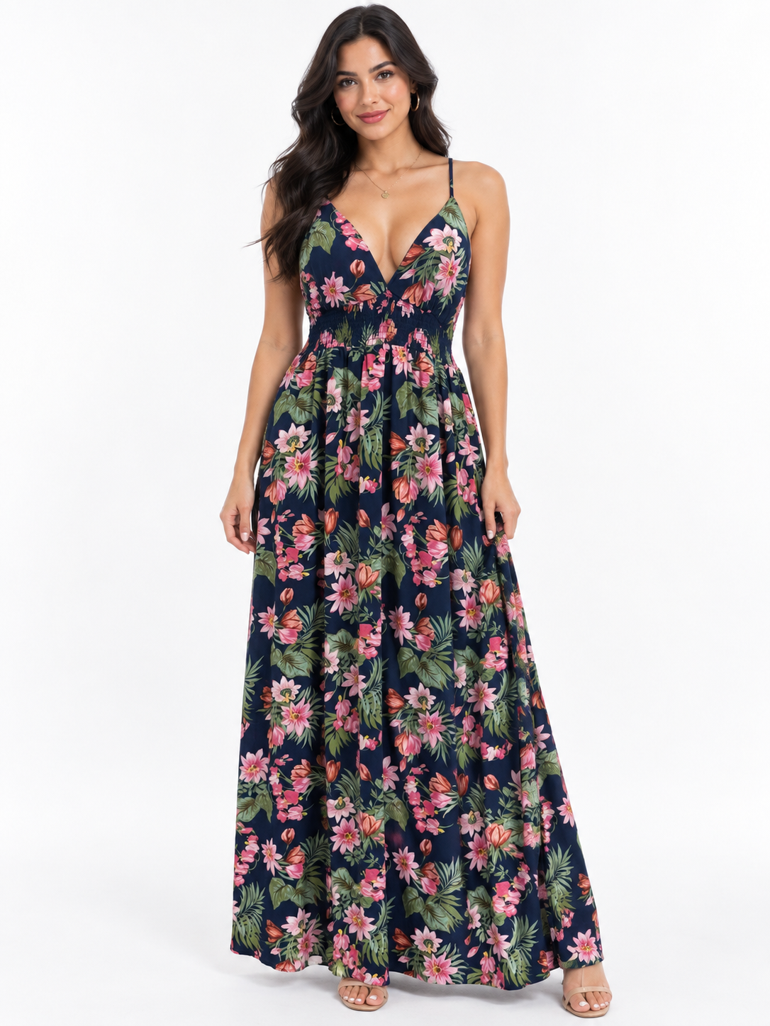 Navy tropical-floral spaghetti-strap deep-V crossback smocked-waist flowy maxi dress - front full-length white background view showing fine spaghetti straps, dramatically plunging deep-V neckline with gathered centre panel, smocked waistband, and enormous voluminous flowy maxi skirt in deep navy with bold pink lotus coral tulip and green tropical foliage print