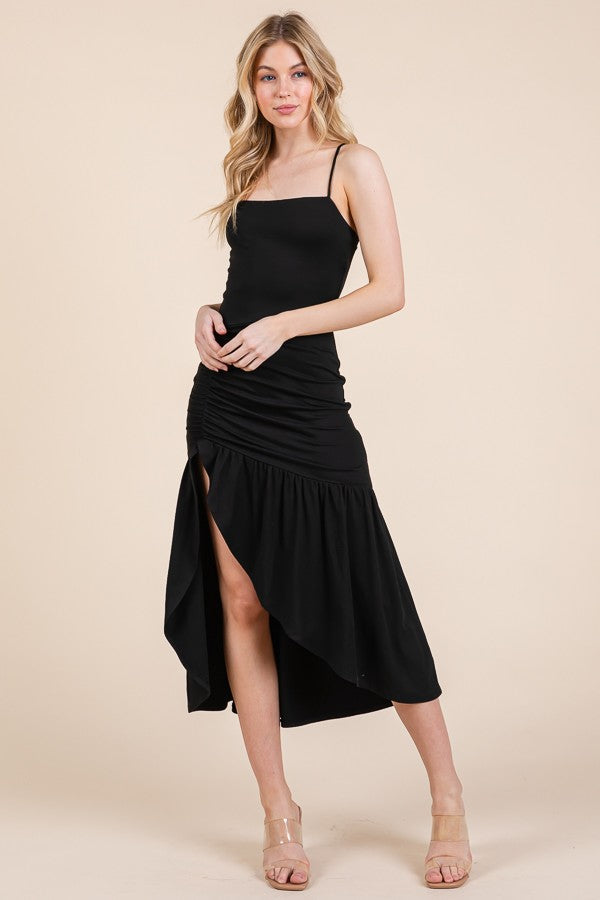 Black square-neck spaghetti-strap side-ruched high-low ruffle-hem midi dress with side slit - alternative front full view showing square neckline, fine straps, fitted bodice, dense side ruching, high-low ruffle hem, and thigh-high front slit in black