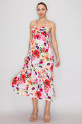 Tropical floral beaded-halter deep-V ruched-bust open-cross-back tiered midi dress - front full-length view showing dramatically plunging deep-V neckline, beaded halter straps, ruched bust panel, and fluid gently tiered midi skirt in white-ground large-scale tropical floral print