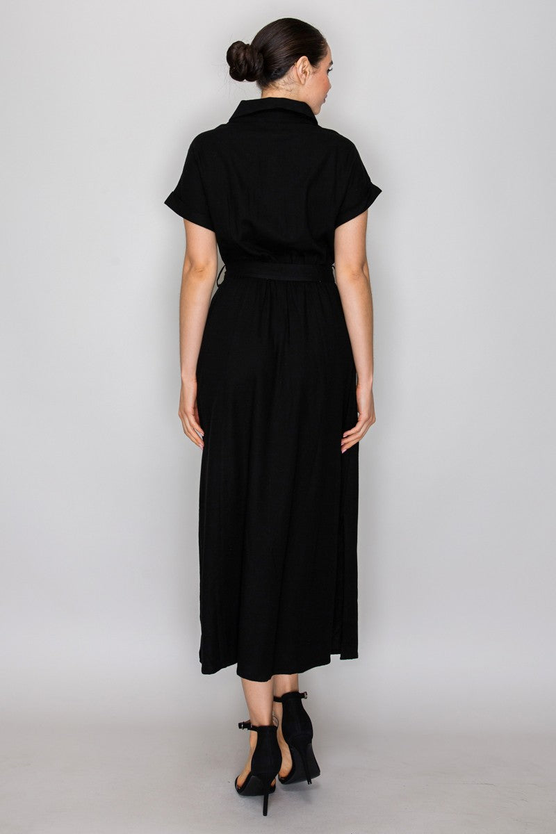 Black short-sleeve shirt-collar button-front belted side-slit maxi dress - back full view showing shirt collar, short cuffed sleeves, self-tie belt at waist from behind, and clean A-line maxi skirt from behind