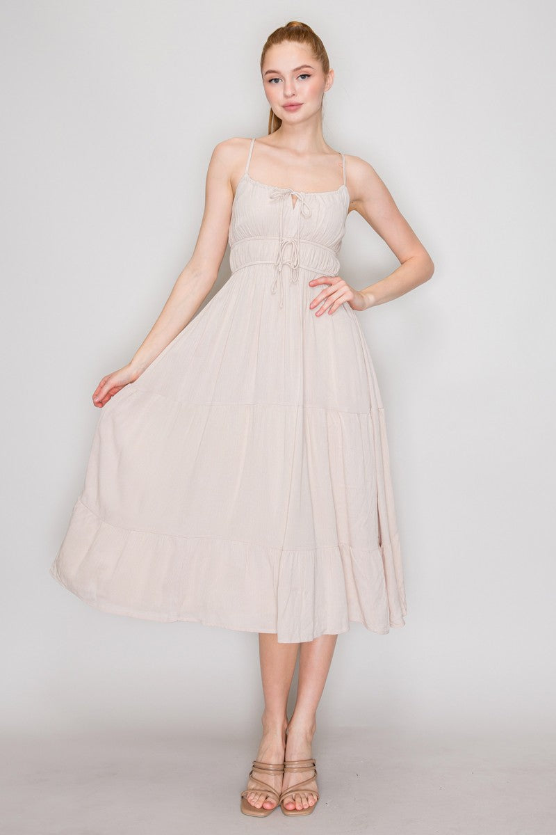 Cream crinkle chiffon spaghetti-strap lace-up corset-bodice tiered midi dress - front full view showing adjustable straps, lace-up neckline tie, ruched corset bodice, waistband lace-up tie, and full tiered midi skirt