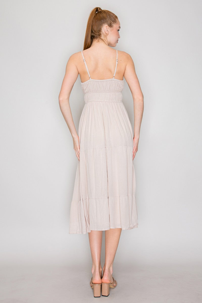 Cream crinkle chiffon spaghetti-strap lace-up corset-bodice tiered midi dress - back full view showing adjustable spaghetti straps with hardware, gathered back bodice, wide waistband, and full tiered midi skirt from behind