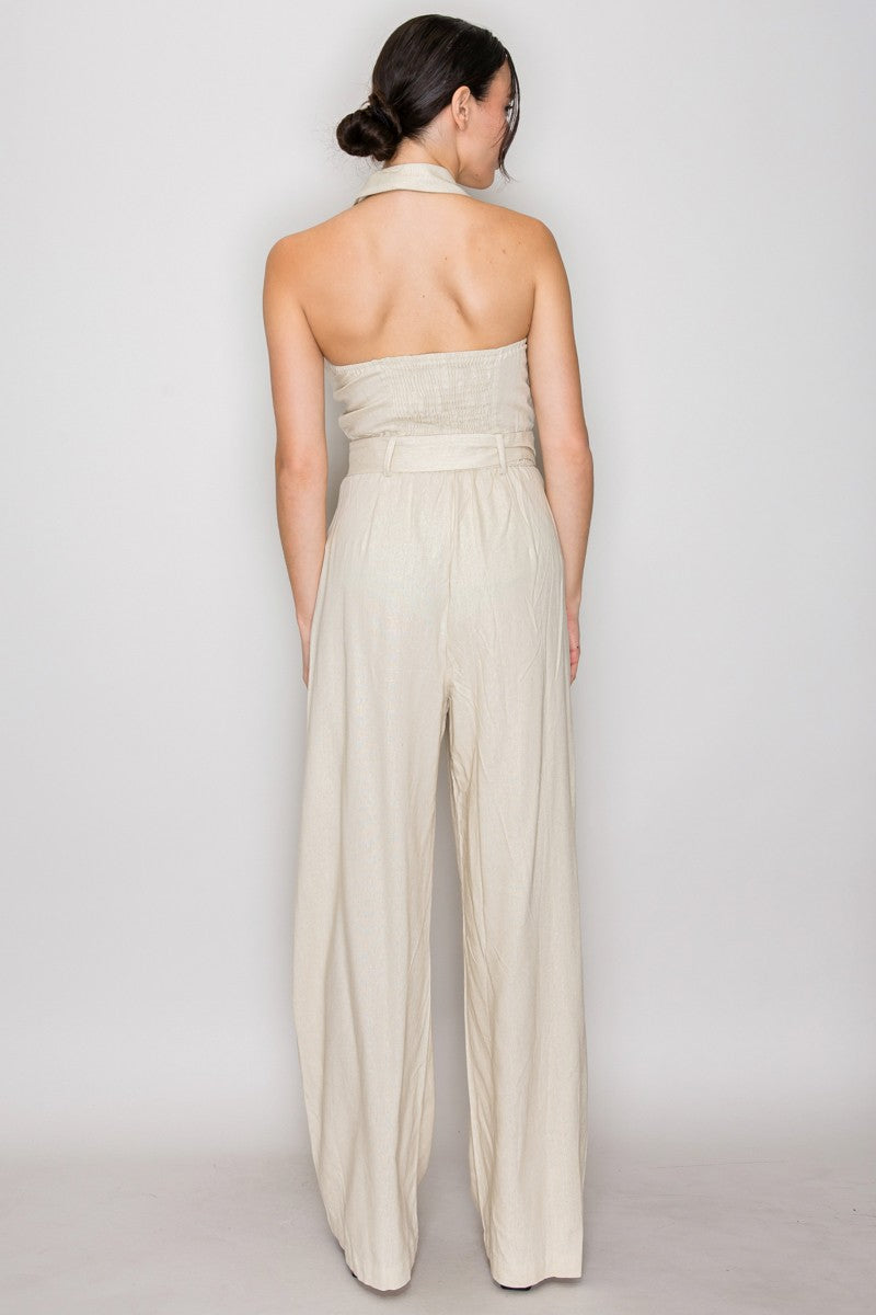 Natural linen halter-collar button-front belted wide-leg jumpsuit - alternate front full view showing open halter collar, button placket, square-buckle belt, and full-length wide-leg trouser silhouette in natural linen