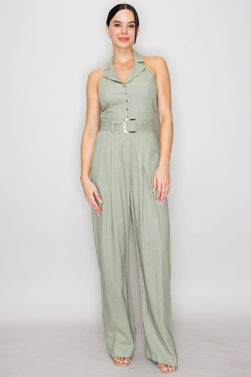 Blush pink halter-collar button-front belted wide-leg jumpsuit - back full view showing dramatic open back, halter neck tie at upper back, and wide-leg trouser from behind in blush pink