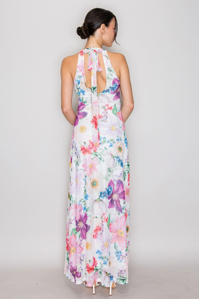 Purple lavender watercolour floral print mesh V-neck halter-tie-back maxi dress - side three-quarter front view showing V-neckline, halter straps, smooth fitted bodice, fluid A-line maxi silhouette, and purple lavender watercolour floral print on white