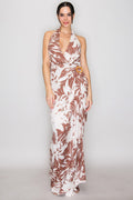 Mocha tropical floral halter deep-V wrap-bodice rattan-ring-buckle wide-leg jumpsuit - alternate front full-length view showing deep-V halter wrap bodice, rattan ring hardware at waist, and sweeping wide palazzo legs in mocha and cream tropical floral