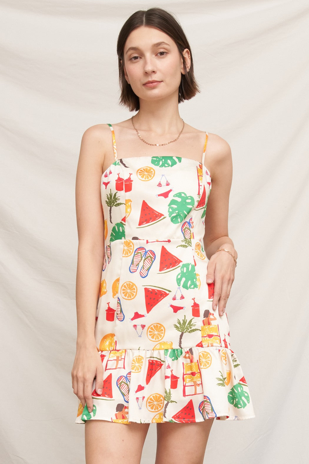 Tropical beach novelty-print spaghetti-strap square-neck fitted-bodice tiered-ruffle-hem mini dress - front full view showing complete silhouette, novelty print, and two-tier ruffle skirt