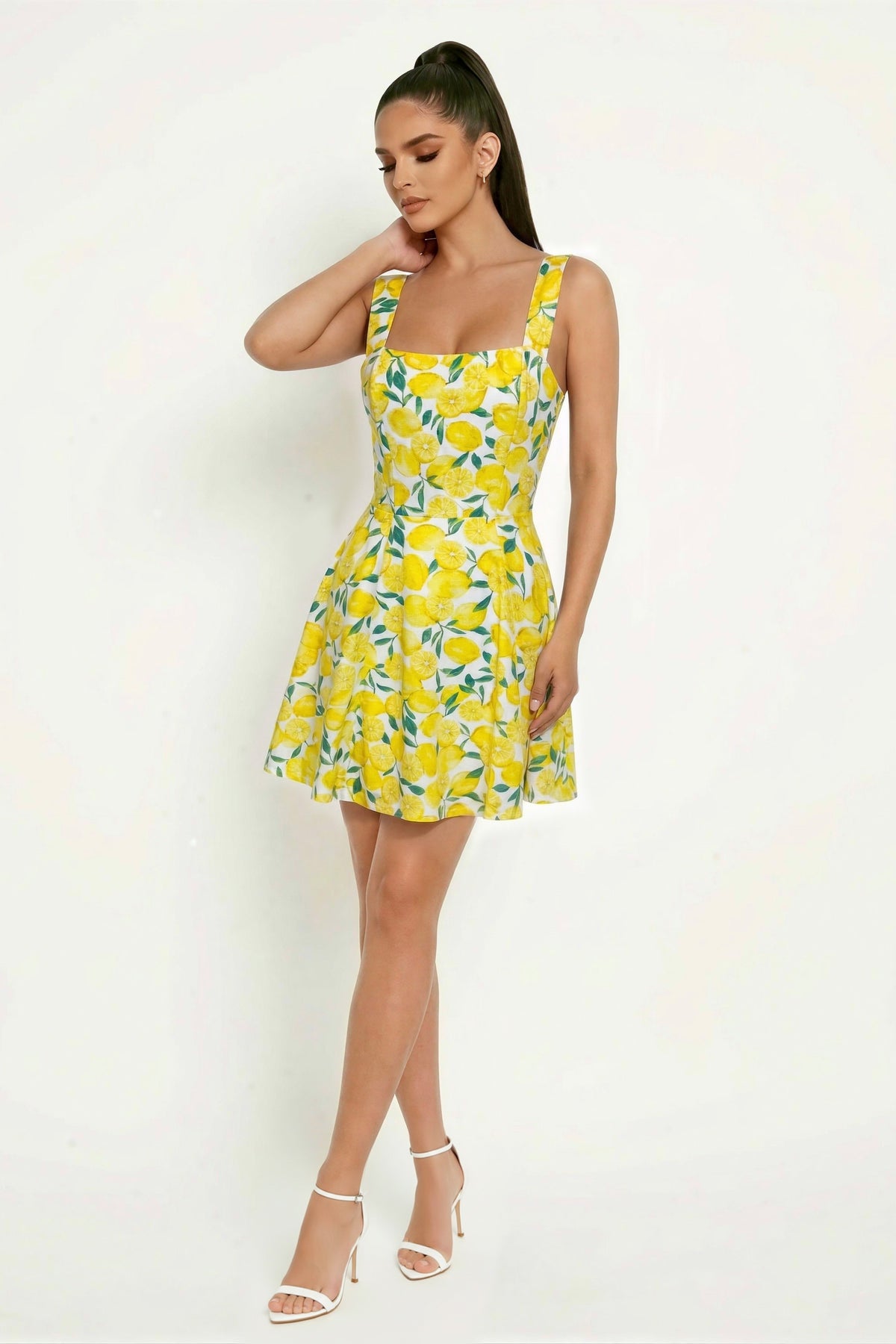 Lemon print wide-strap square-neck fitted-bodice open-back full-skirt skater mini dress - three-quarter front view showing fitted bodice and skirt volume