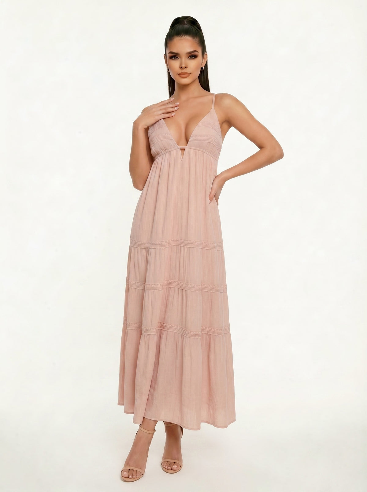 Blush spaghetti-strap deep-V lace-trim empire-waist tiered maxi dress - side three-quarter view showing spaghetti straps, deep-V bodice profile, lace trim detail, and full tiered maxi skirt silhouette from the side in soft dusty blush
