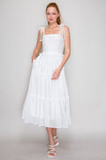 White square-neck smocked-bodice crochet-lace-strap tie-bow tiered midi dress - front full view showing clean square neckline, wide crochet lace straps with bow ties at shoulders, fully smocked bodice, double ruffle waist accent, and generous tiered midi skirt in crisp white