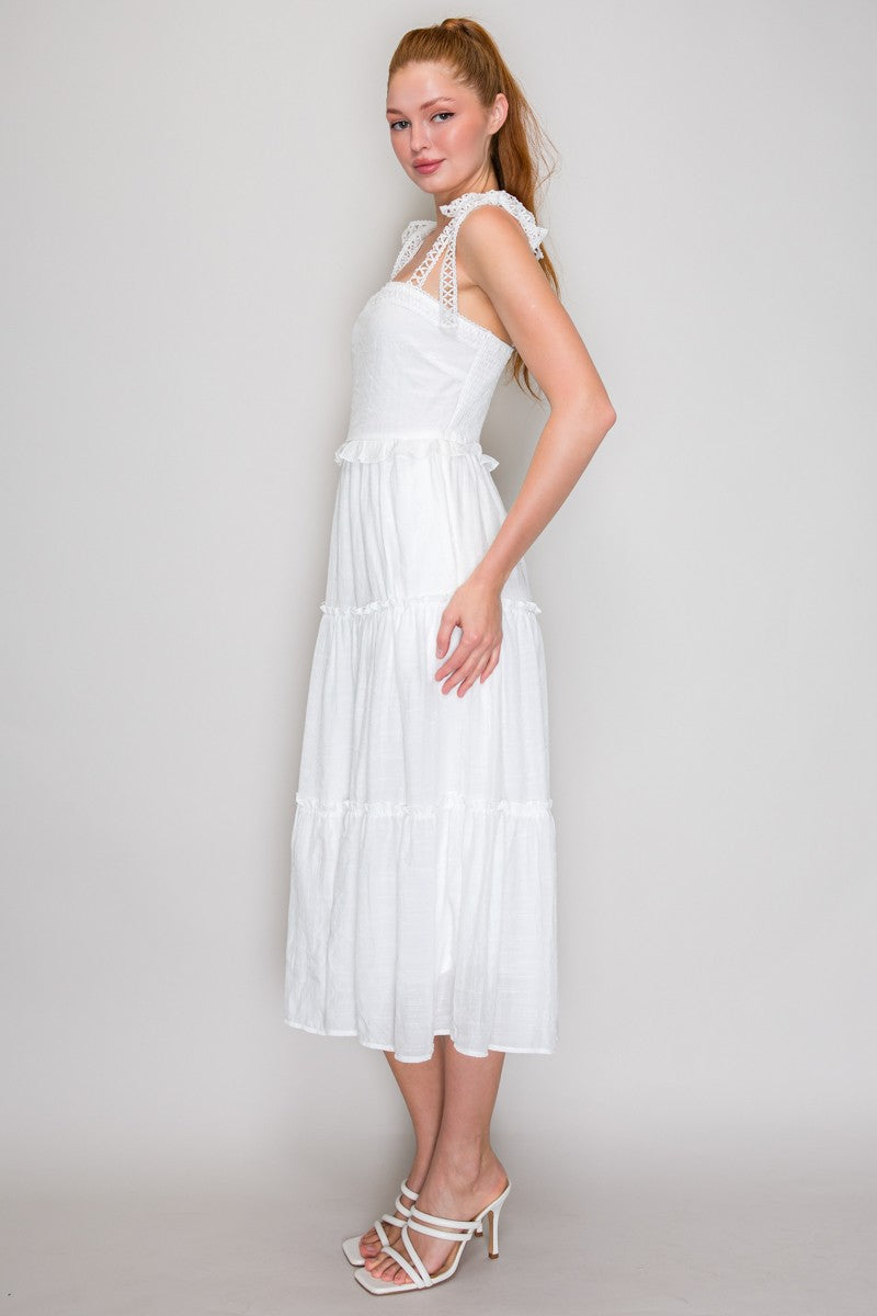 White square-neck smocked-bodice crochet-lace-strap tie-bow tiered midi dress - side full-length view showing crochet lace strap profile, smocked bodice silhouette, double ruffle waist transition, and full tiered A-line midi skirt from the side in white