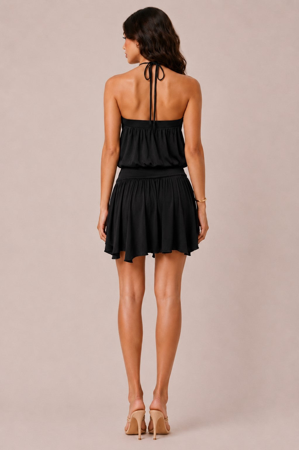 Black grommet halter criss-cross tie-back blouson flowy mini dress - back view showing open back