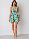 Tropical floral halter plunge tie-front cut-out smocked back flared mini dress - front full view