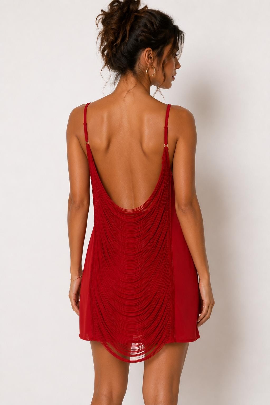Deep red spaghetti-strap deep-V cowl-neck open-back distressed-knit slip mini dress - back view showing completely open cowl back plunging to lower back, spaghetti straps, and distressed knit from behind
