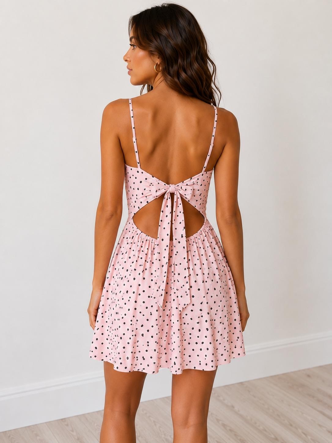 Cream polka dot spaghetti-strap V-neck open-back bow-tie tiered A-line mini dress - side view showing tiered A-line skirt