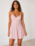 Cream polka dot spaghetti-strap V-neck open-back bow-tie tiered A-line mini dress - front view showing V neckline and fitted bodice