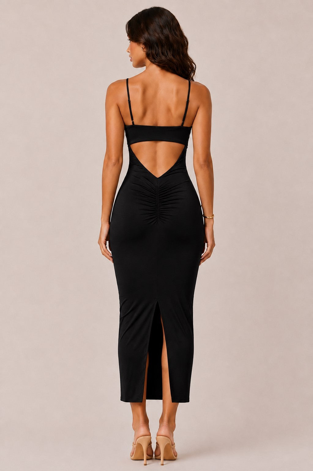 Black deep-V spaghetti-strap gold-ring cut-out open-back ruched bodycon midi dress - side view showing deep V neckline profile, gold ring cut-out, spaghetti straps, smooth bodycon silhouette, and midi length in black