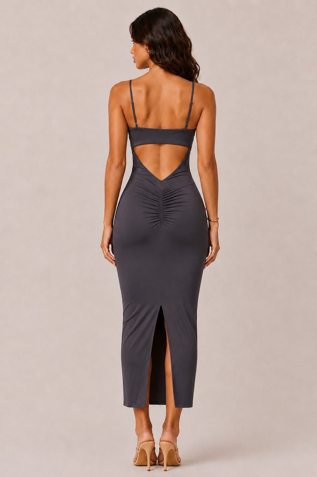 Black deep-V spaghetti-strap gold-ring cut-out open-back ruched bodycon midi dress - back full view showing dramatic angular open-back V cut, spaghetti straps, centre-back ruched panel, and back centre slit at midi hem in black