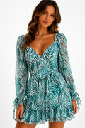 Teal zebra print deep-V long-sleeve tie-waist open-back tie-cuff ruffle-hem mini dress - back view showing dramatic open scoop back and tie cuffs