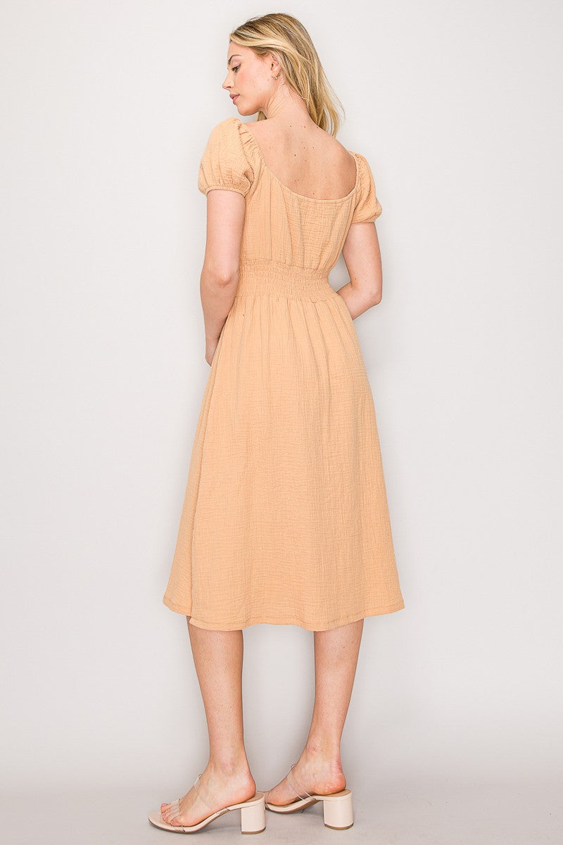 Peach crinkle-woven sweetheart-neck front-tie puff-sleeve smocked-waist fit-and-flare midi dress - back view showing open sweetheart back, puff sleeves, and smocked waistband