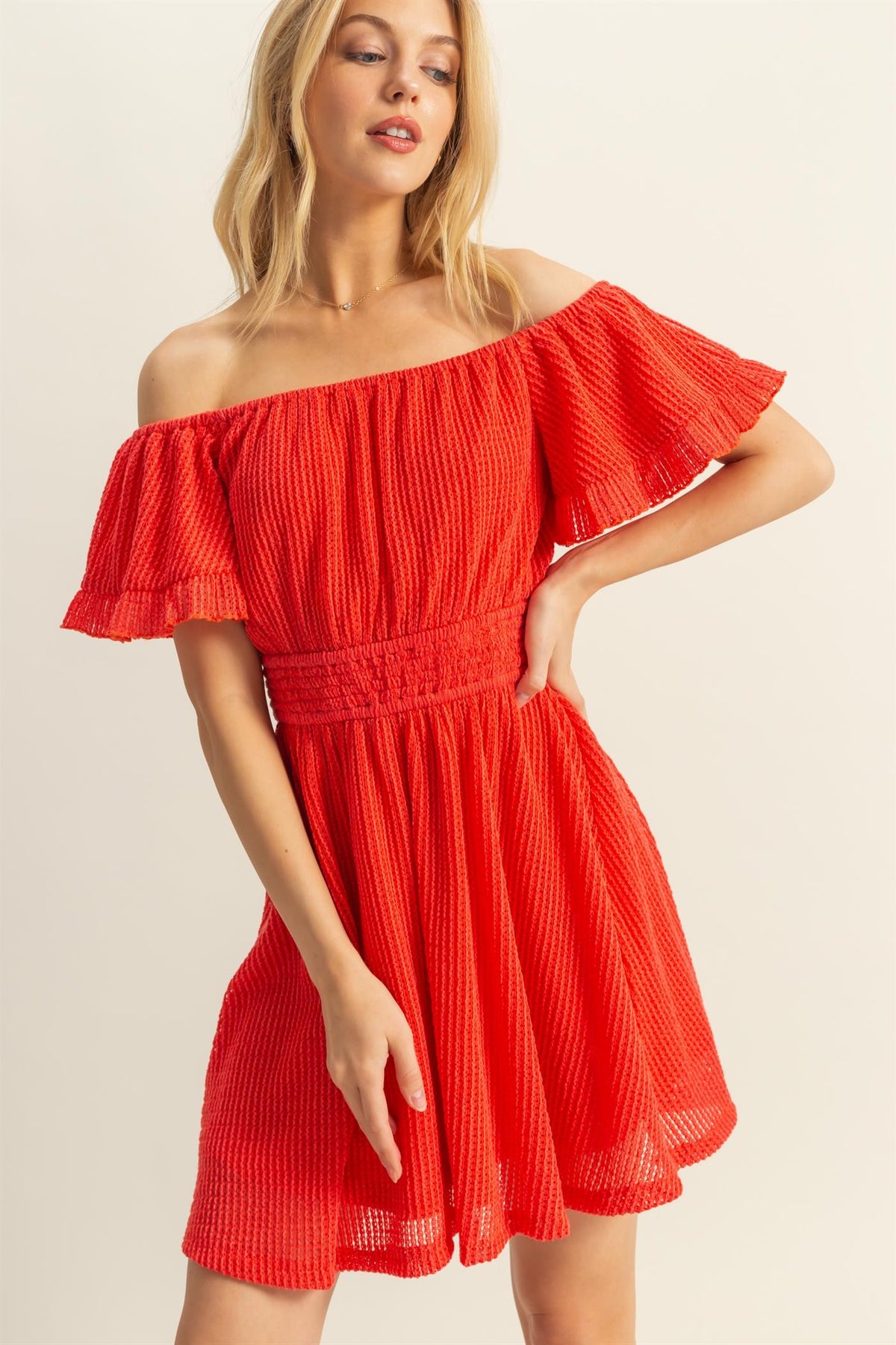 Red textured off-shoulder ruffle-sleeve smocked-waist fit-and-flare mini dress - additional front three-quarter view
