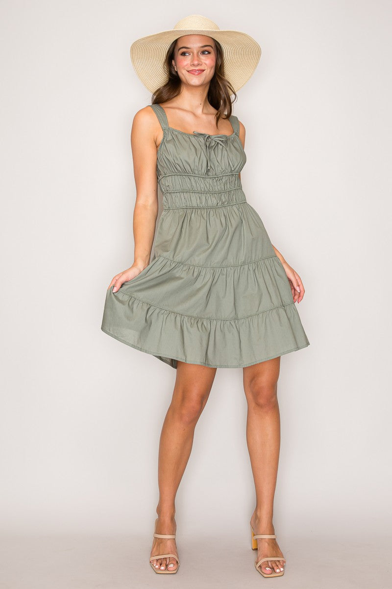 Butter yellow square-neck tie-front smocked-waist tiered mini dress - front full-length view showing tiered skirt silhouette