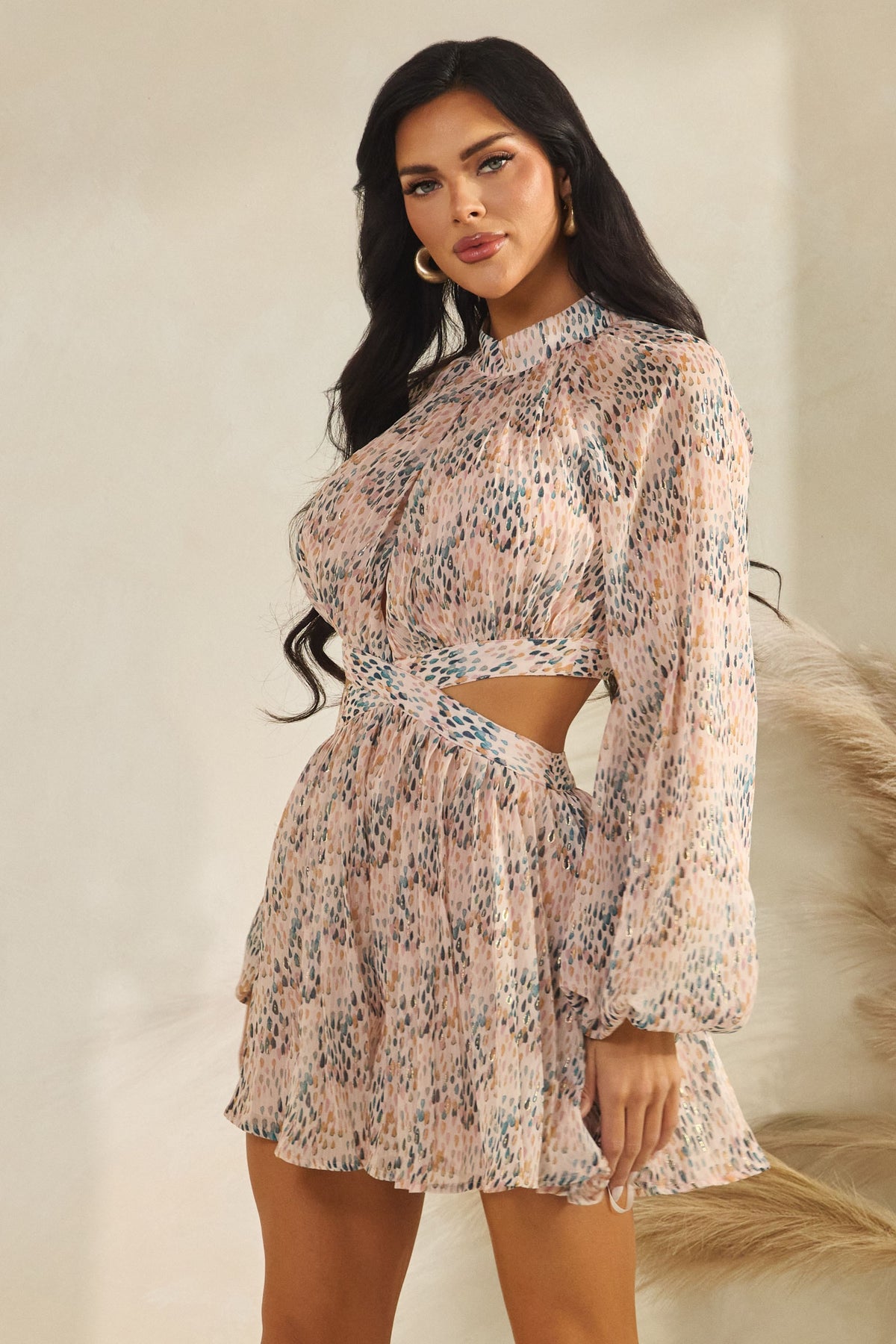 Blush pink abstract-print high-neck front-keyhole balloon-sleeve side-cutout pleated mini dress - side view showing side cutout detail, waistband, and full skirt