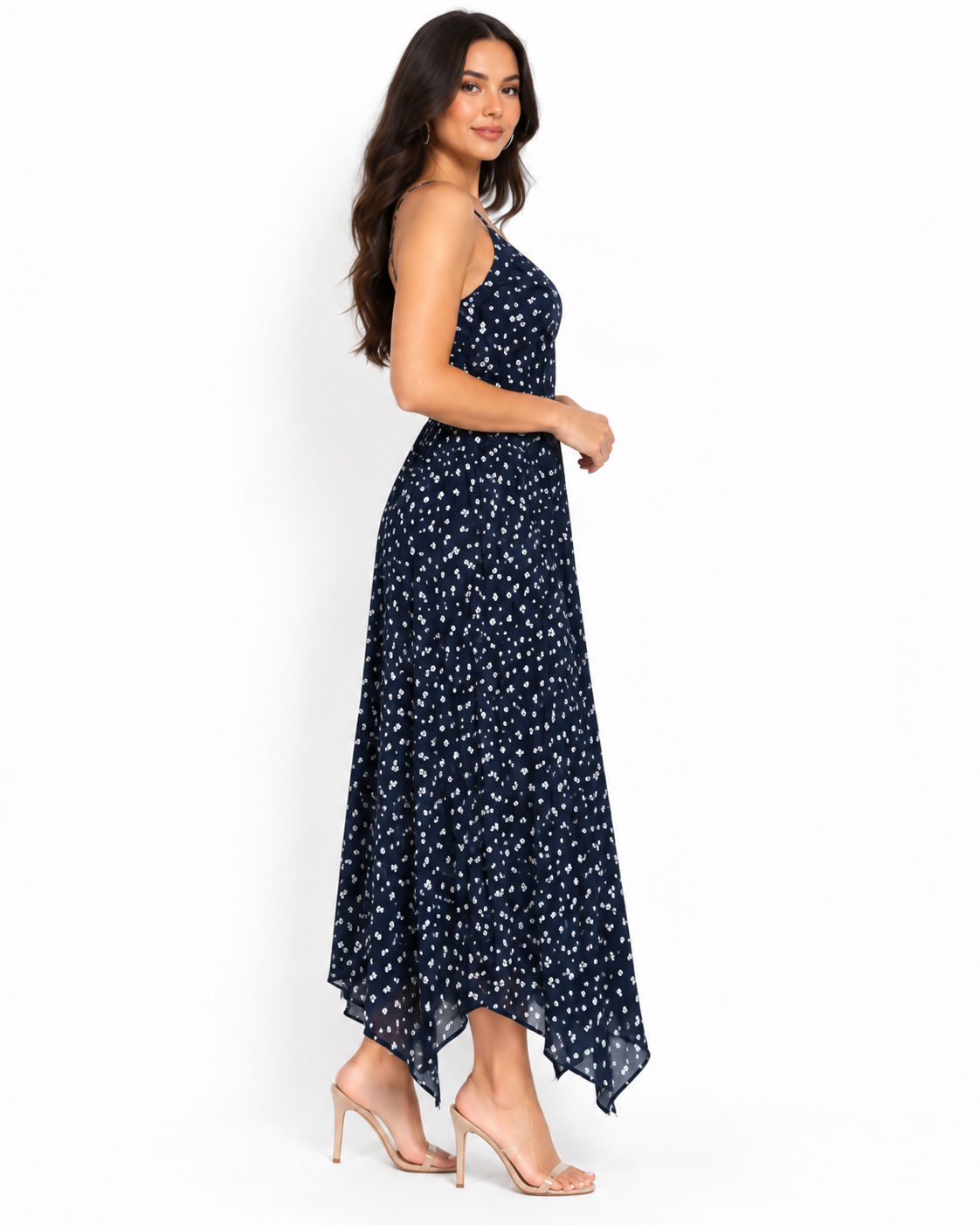 Navy ditsy-floral spaghetti-strap smocked-back handkerchief-hem midi dress - front white background view showing fine spaghetti straps, softly scooped V-neckline with gathered bust panel, and voluminous flowing handkerchief-hem skirt in deep navy with white ditsy florals