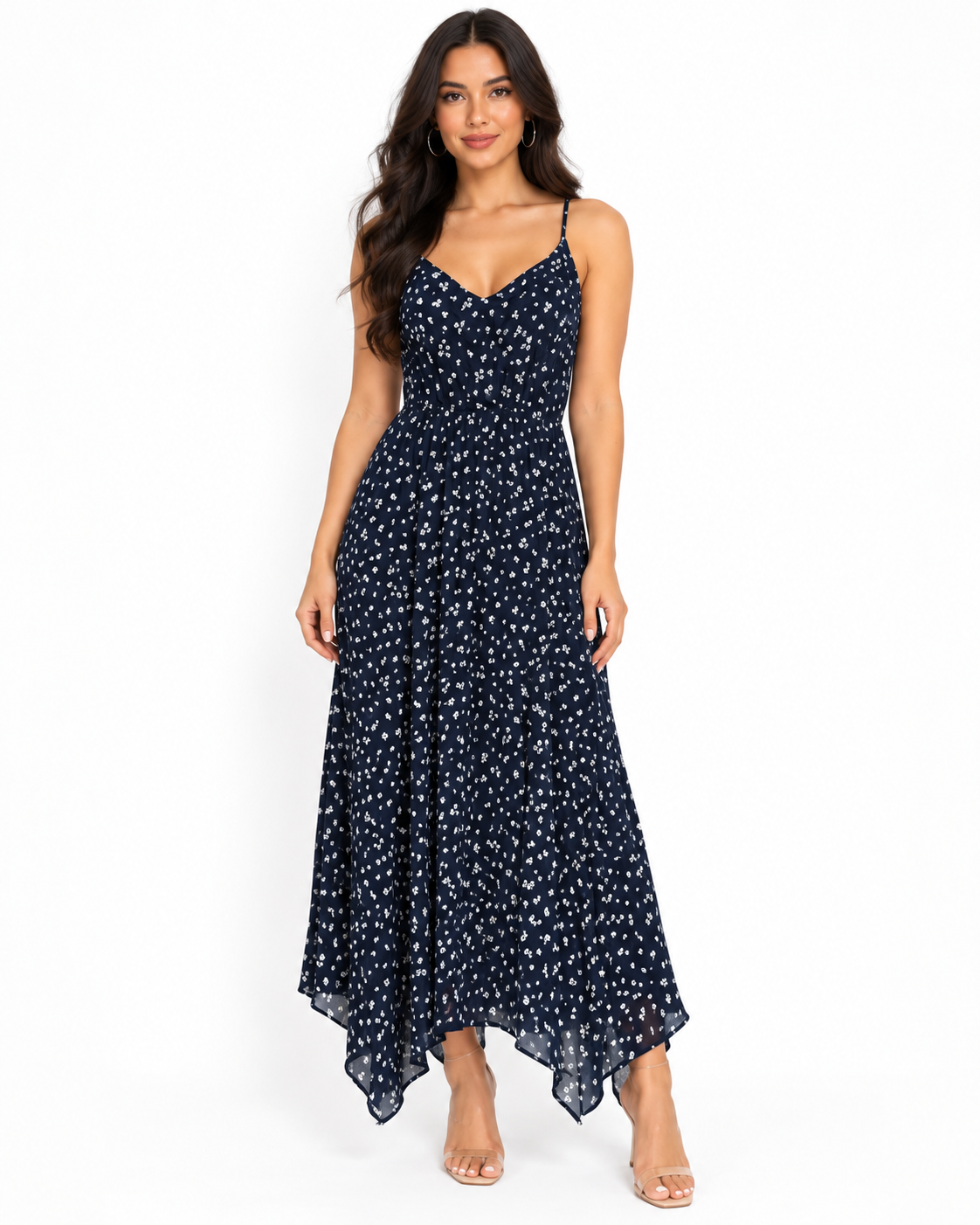 Navy ditsy-floral spaghetti-strap smocked-back handkerchief-hem midi dress - side three-quarter white background view showing fine spaghetti straps, V-neckline profile, and flowing handkerchief-hem skirt silhouette from the side in deep navy with white ditsy florals