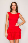 Red sleeveless scoop-neck fitted-bodice triple-tiered-ruffle-skirt mini dress - second front view smiling, showing full silhouette with fitted bodice and cascading tiered ruffle skirt