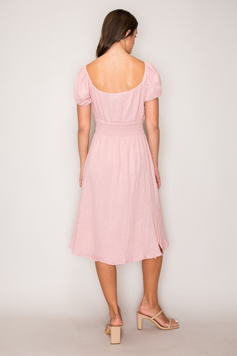 Blush pink crinkle-woven sweetheart-neck front-tie puff-sleeve smocked-waist fit-and-flare midi dress - back view showing open sweetheart back neckline and smocked waistband