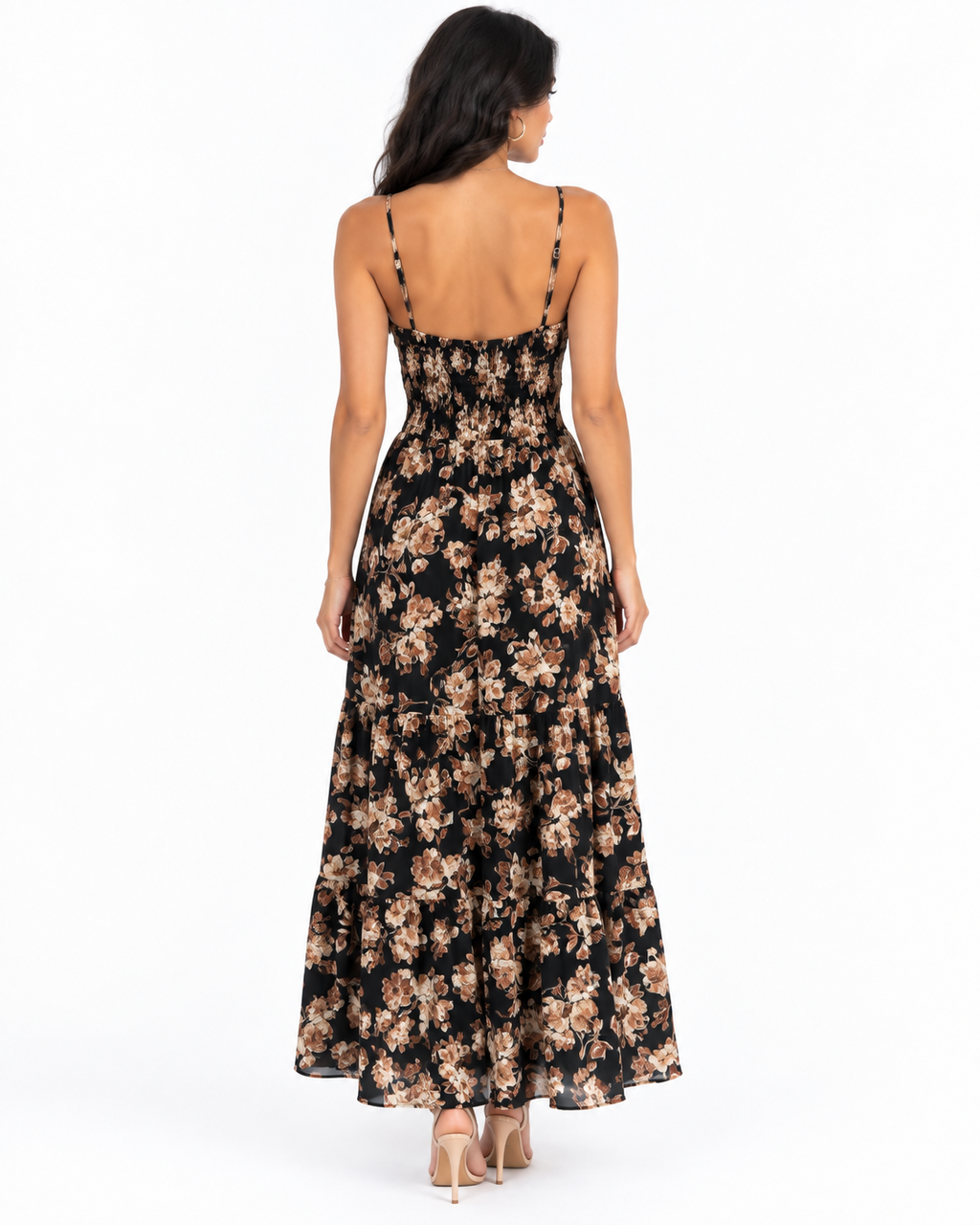 Black botanical-floral spaghetti-strap tie-front smocked-waist tiered maxi dress - back full-length view showing fine adjustable spaghetti straps with gold hardware, open low back above smocked waistband, and voluminous two-tier floral chiffon maxi skirt from behind in black botanical print