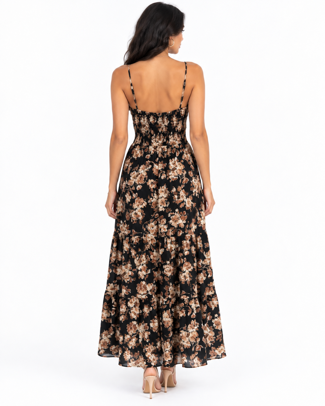 Black botanical-floral spaghetti-strap tie-front smocked-waist tiered maxi dress - back full-length view showing fine adjustable spaghetti straps with gold hardware, open low back above smocked waistband, and voluminous two-tier floral chiffon maxi skirt from behind in black botanical print