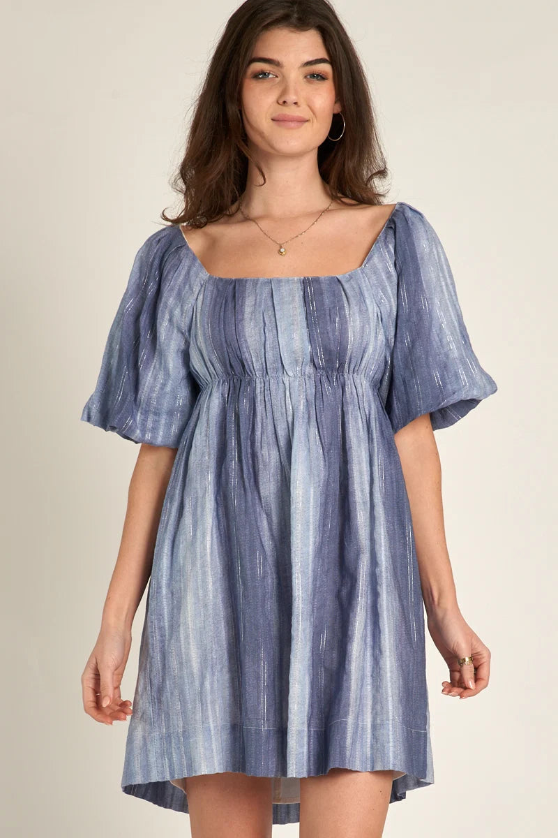 Periwinkle blue shimmer stripe puff sleeve open back tie babydoll mini dress - front smiling view