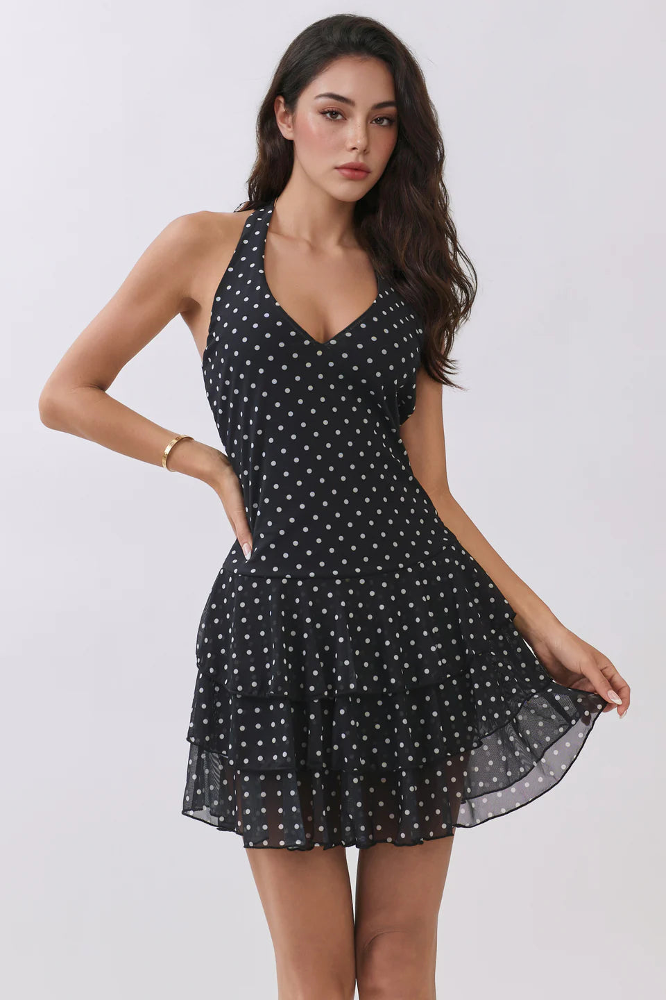 Black polka dot halter V-neck tiered ruffle mini dress - front view