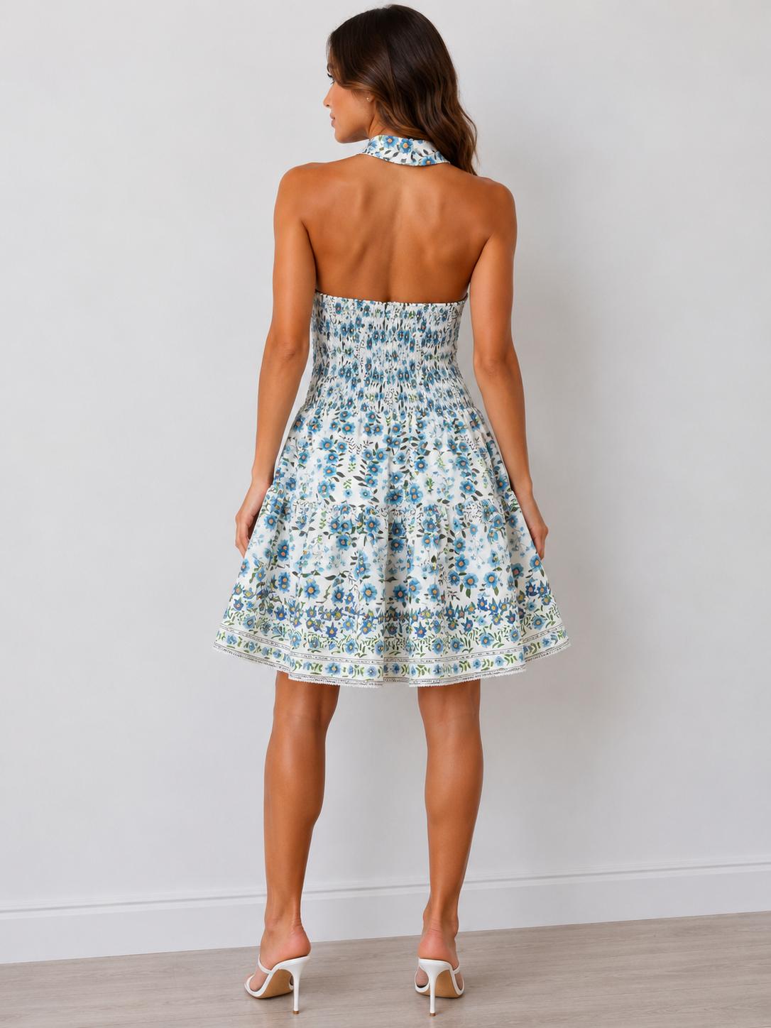 Blue botanical halter square-neck smocked waist fit-and-flare border print mini dress - back view showing open back and smocked waist detail