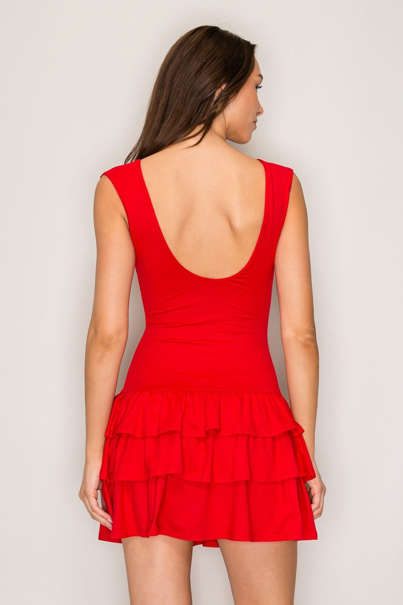 Red sleeveless scoop-neck fitted-bodice triple-tiered-ruffle-skirt mini dress - back view showing deeply scooped open back, wide armholes, and three-tier ruffle skirt from behind