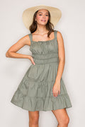Sage green square-neck tie-front smocked-waist tiered mini dress - front close-up view showing neckline tie and smocked waist