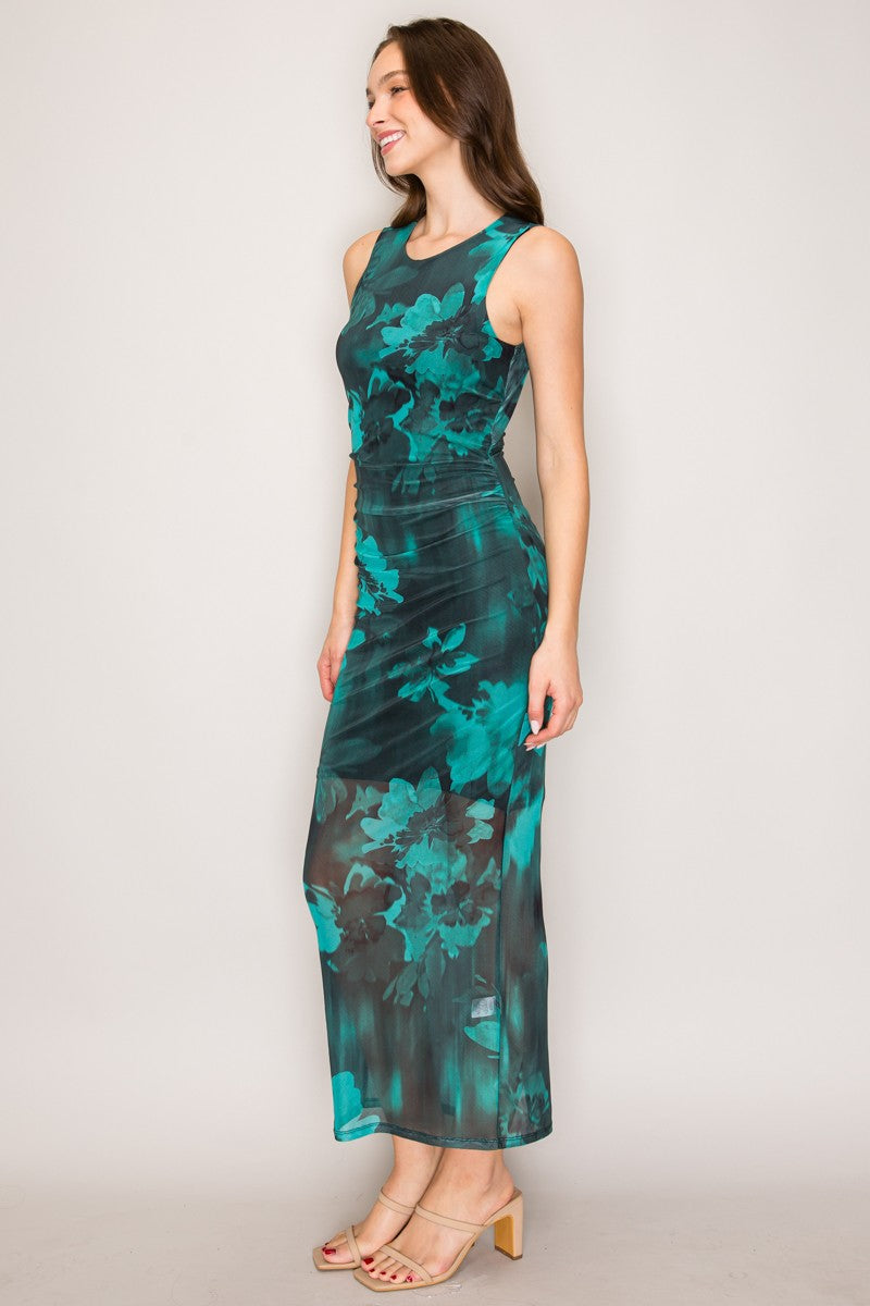 Emerald watercolour floral mesh sleeveless crew-neck ruched open-back bodycon maxi dress - side full view showing clean armhole, side-seam ruching, bodycon maxi silhouette, and sheer mesh hem in profile