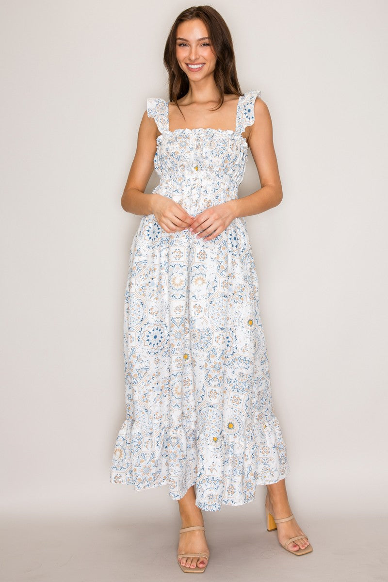 White botanical tile-print square-neck ruffle-strap smocked-bodice tiered midi dress - front full-length view showing clean square neckline with ruffle trim, wide ruffle-edged straps, fully smocked bodice, and generously tiered A-line midi skirt in white botanical tile block-print