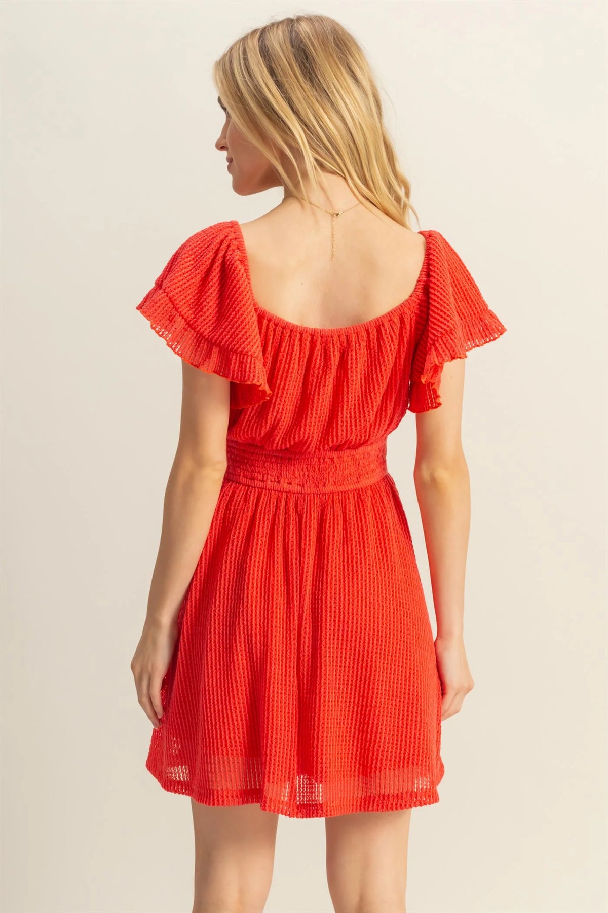 Red off-shoulder ruffle sleeve smocked waist mini dress - back view