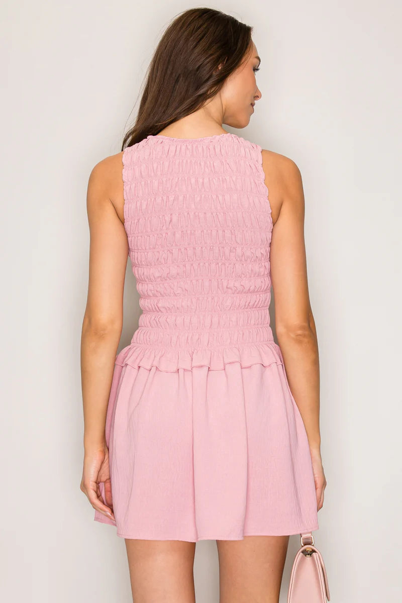 Mauve pink smocked bodice drop waist mini dress - front view