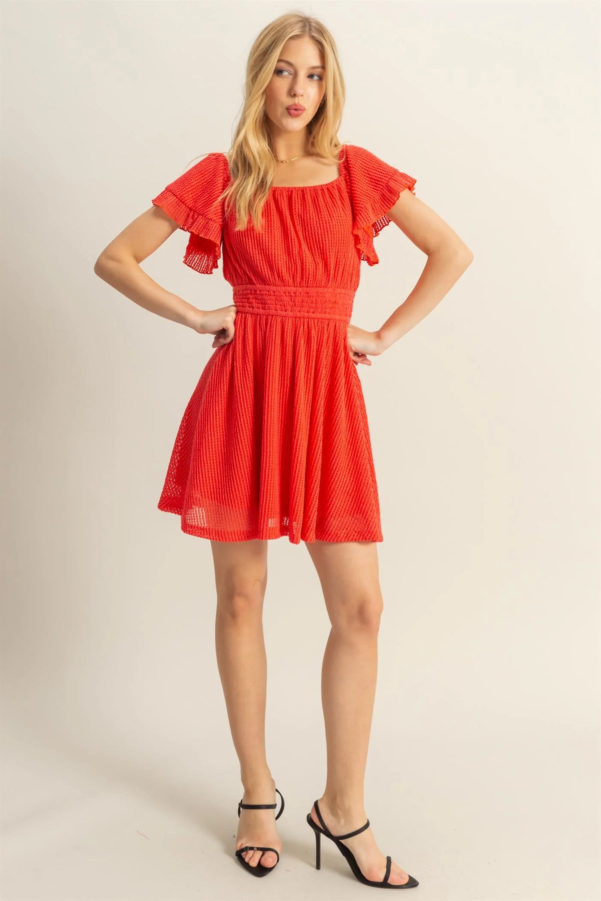 Red off-shoulder ruffle sleeve smocked waist mini dress - front view