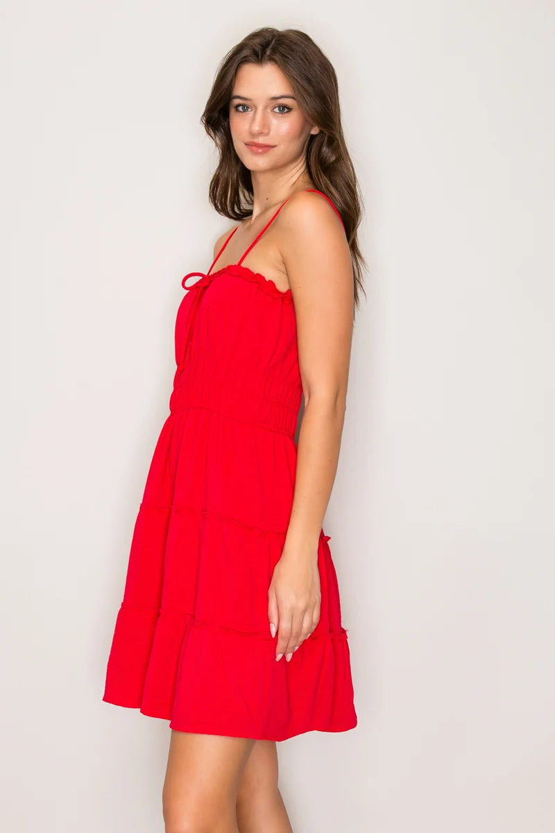 Cherry red ruffle trim tie-front smocked waist tiered mini dress - side view
