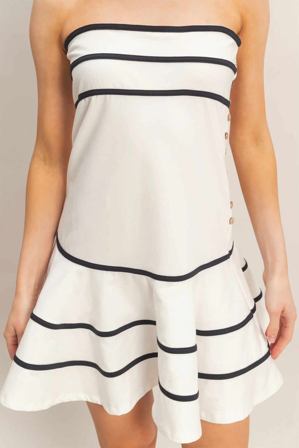 White strapless contrast trim gold button tiered ruffle mini dress - front view