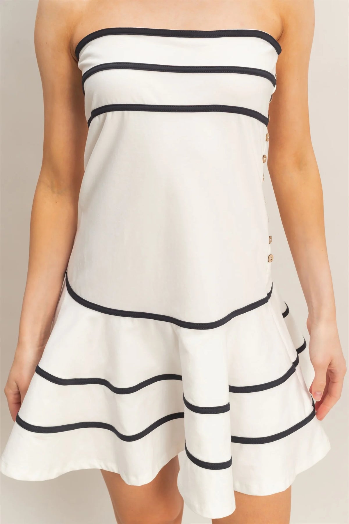 White strapless contrast trim gold button tiered ruffle mini dress - front view