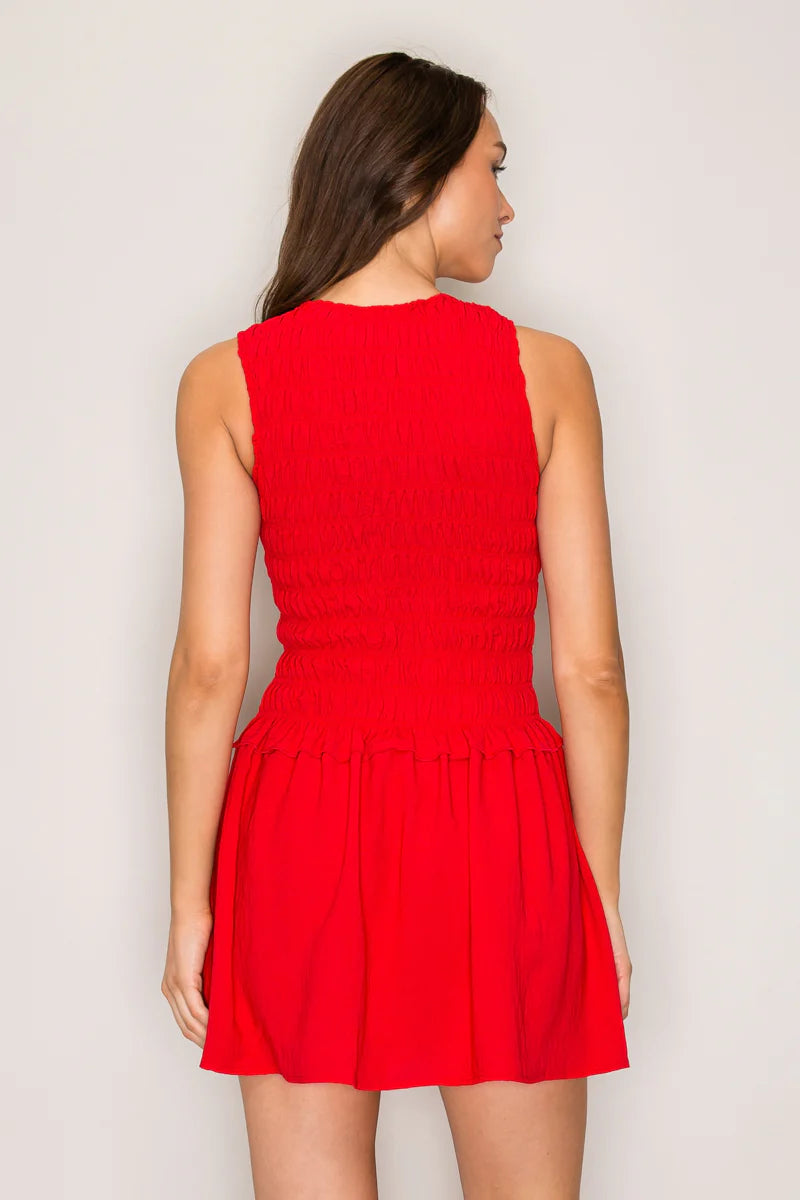 Red smocked bodice drop waist mini dress - back view