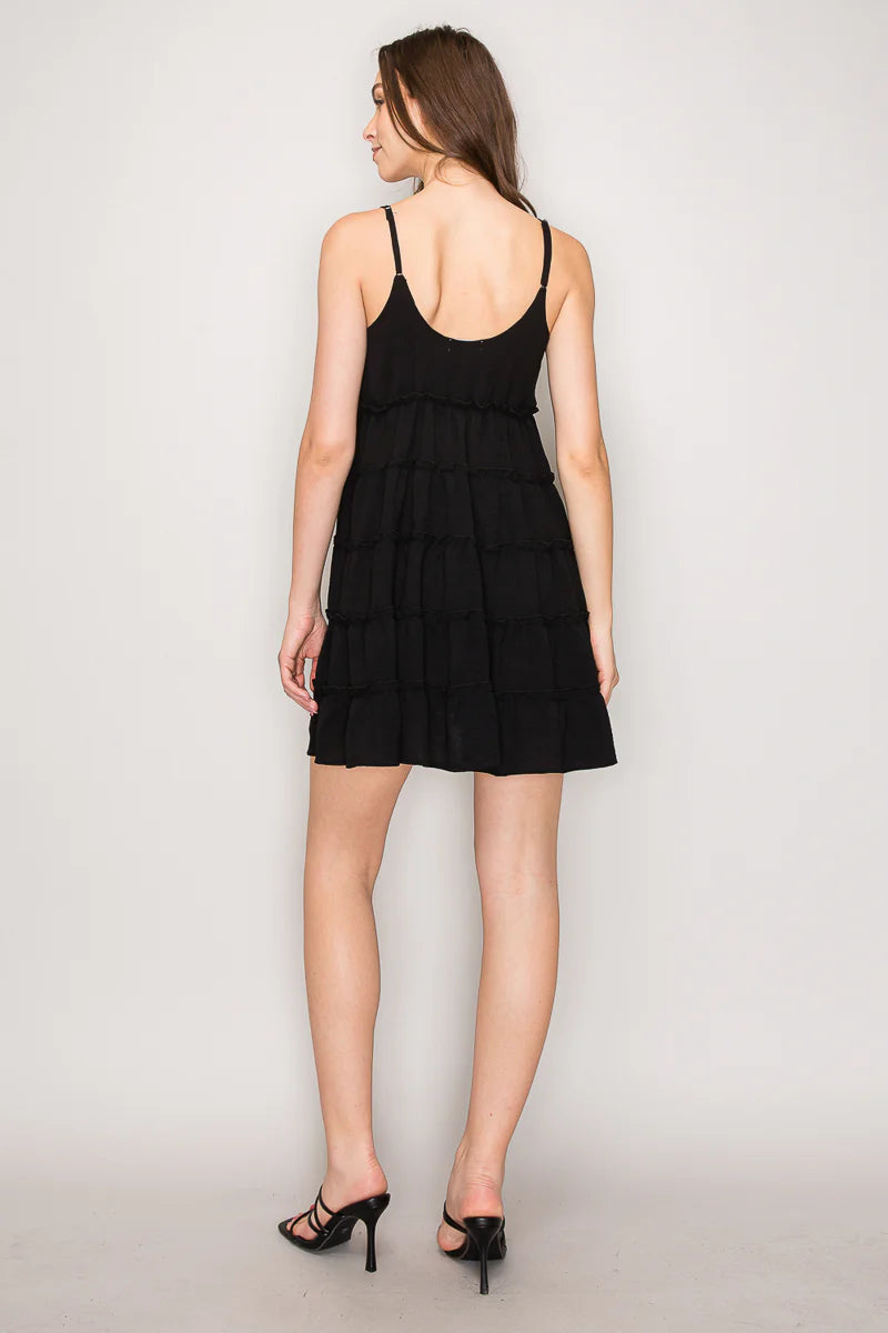 Black V-neck tiered ruffle babydoll mini dress - front view